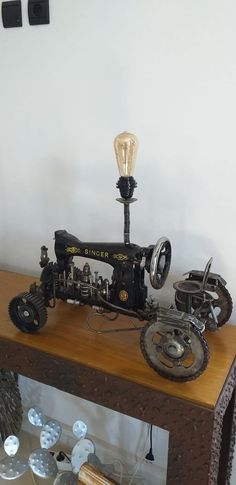 an antique sewing machine on display in a museum