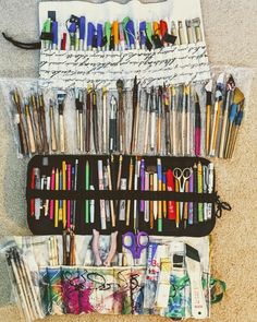 an assortment of pens, scissors and other crafting supplies