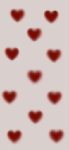 red hearts are arranged in the shape of heart shapes on a light gray background with black dots