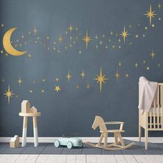 a child's room with stars and a rocking horse