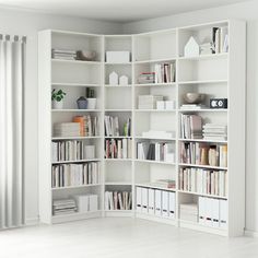 a white bookcase filled with lots of books