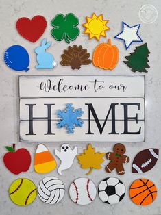 a sign that says welcome to our home surrounded by various sports and pumpkins on it