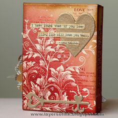 an altered book with a heart and cross on the front, decorated with words that read i love you