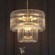 a chandelier hanging from the ceiling in a room