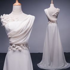 two white dresses on mannequins, one with flowers and the other without