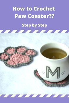 a crochet coaster with a dog paw on it next to a cup of tea