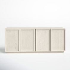 an empty white cabinet with four doors