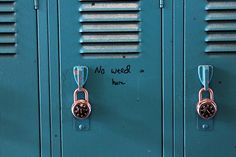 two blue lockers with one has a watch on it