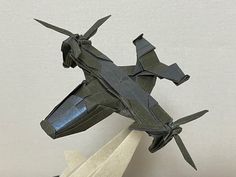 an origami model of a fighter jet on display