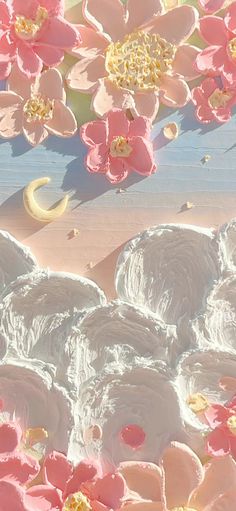 pink and white flowers are floating in the air next to a half moon on a blue surface