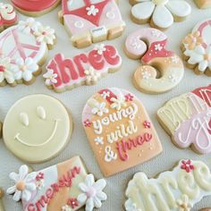decorated cookies are displayed on a table