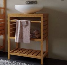 a bathroom with a sink and towel rack