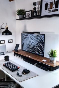 a computer desk with a keyboard, mouse and monitor