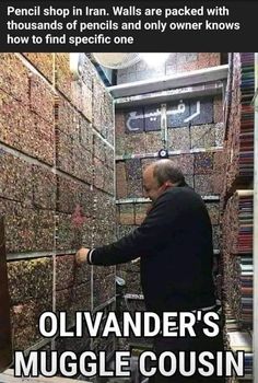 a man is looking at stacks of books