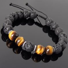 "Handmade Men Women Adjustable Gemstone Bracelet 10mm Natural Lava Rock 10mm Natural High Quality Brown Tiger Eye Tibetan Silver Spacers Chinese Strong Braided Cords Best fit for *wrist size from 7\" / 17.78cm to 8\" / 20.32cm (may fit larger wrists but more string will be showing) Discount Coupons @ https://www.etsy.com/shop/DiyNotion/about?ref=shopinfo_about_leftnav We go by wrist size but not the length of bracelet. See measuring requirement at: www.diy-notion.com/wrist FREE Shipping to The U Brown Tiger, Brown Tiger Eye, Bracelets Handmade Diy, Natural High, Lava Rock, Bijoux Diy