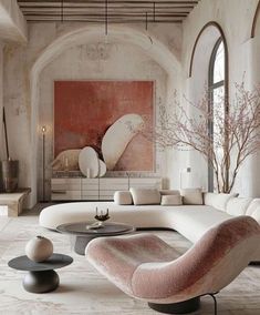 an elegant living room with white and pink furniture