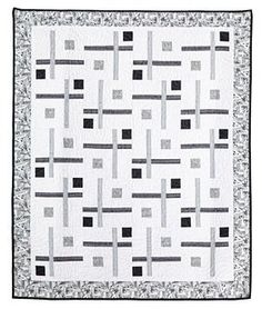 a black and white quilt with squares on it