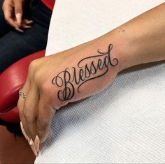 PINTEREST: SUPREME CORA🎭 Blessed Tattoo Ideas For Women, Zayden Tattoo, Middle Neck Tattoos Women, 100 Bill Tattoo, Cursive Lettering Tattoo, Loyalty Tattoo Stencil, Finger Word Tattoos, Blessed Hand Tattoo, Side Of Hand Tattoos For Women