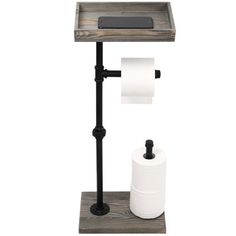 a toilet paper dispenser with two rolls of toilet paper on it and a cell phone next to it