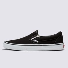 The Slip-On that’s been Setting Trends Since 1979Vans #98 was introduced in 1979, but this Classic Slip-On has come a long way. Black Slip-On sneakers don't come more stylish and spectacular than this. The low-profile canvas uppers, supportive padded collars, and rubber waffle outsoles take care of the comfort. All that remains is to slide in and hit the road. Vans beloved Slip-On sneakers provide convenience and comfort in equal measure. A Classic Slip-On sneaker for the modern world? Look no f Black Slip On Vans, Vans Slides, Slip On Vans, Black Slip On Sneakers, Timeless Shoes, All That Remains, Handbag Essentials, Black Slip On Shoes, Sneakers Vans