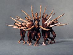 a group of ballet dancers posing for a photo