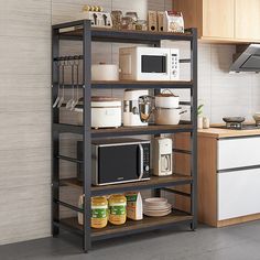 a kitchen with a microwave, toaster oven and other items on the shelving