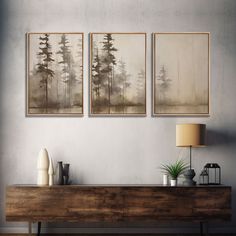 three paintings hang on the wall above a dresser