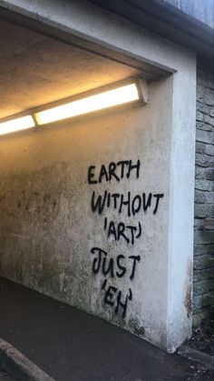 graffiti on the side of a building that says earth without art just ehh