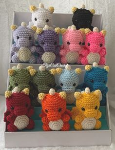 there are many crocheted stuffed animals in the box