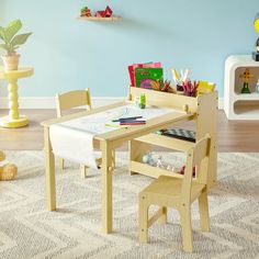 a child's wooden table and chairs in a playroom