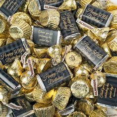 a pile of gold foiled chocolates with happy 50th written on the wrappers