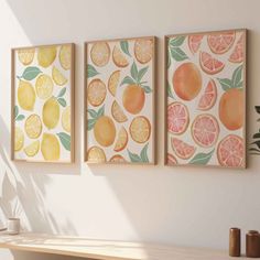 three paintings hanging on the wall above a table