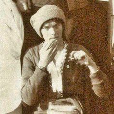 an old black and white photo of three people posing for the camera with their hands on their chins