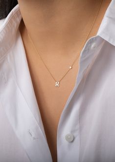 Beautifully handcrafted 14k solid gold initial and a small bezel diamond on a dainty cable link chain necklace. Available in 14k white and yellow gold, this stunning piece will be you new favorite necklace! Wear it with your initial or your loved one's. Size of Initial: Approx. 5mm Diamond Carat Weight: Approx. 0.03 ctw Diamond Clarity: VS Standard Production: 4-9 business days Rush Order Production: 2-5 business days Shipping: Select shipping method at checkout.2-Day Shipping and Overnight ship Dainty Diamond Initial Necklace, Initial Necklace With Diamond, H Necklace Initial, Dainty Initial Necklace Gold, Initial Necklace Aesthetic, H Initial Necklace, Small Initial Necklace, Couple Ring Design, Neck Pieces Jewelry