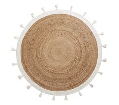 a round rug with white tassels on the bottom and an oval design in the middle