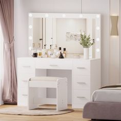 a white vanity with lights on it and a bed next to it in a bedroom