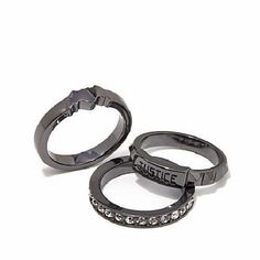 two black rings with the word police written on them and some diamonds in each ring