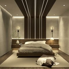 a large bed sitting in the middle of a bedroom next to a wall mounted lamp