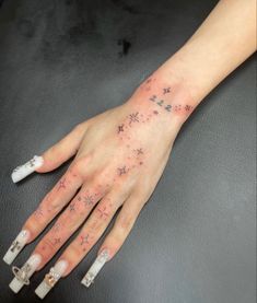 a woman's hand with stars on it