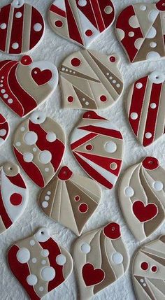 some red and white heart shaped cookies on a table