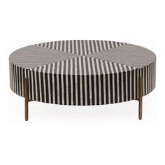 a black and white striped coffee table with wooden legs