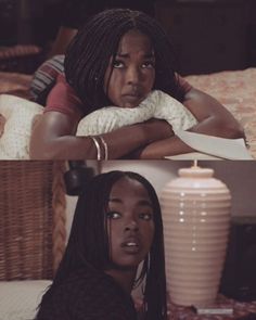 two black women sitting on a bed one with her arms crossed