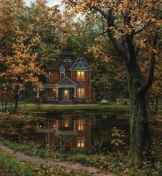 a painting of a house next to a pond with trees around it and lights on