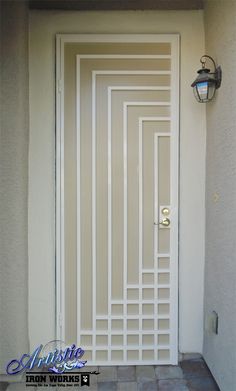 a white door that is open on a wall in front of a light fixture and tile floor