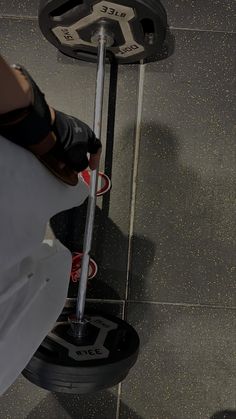 a person standing next to a weight scale