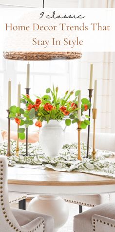 a dining room table with flowers and candles on it, in front of a window