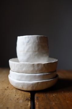 three white bowls stacked on top of each other