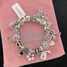 Linx Snake Chain Style Charm Bracelet With A Ball Clasp, Featuring Linx Logo. The Bracelet Comes With 11 Unbranded And 8 Linx Charms In Sterling Silver, With Other Alloy Metals, And 925 Sterling Silver. *The Bracelet Is Available In Multiple Sizes *Additional Charms Can Also Be Added To The Bracelet And The Ones Included Are Removable As Well. *All Of Our Items Are New, Directly From Our Store And Will Be Delivered In A Luxury, Signature Pink, Linx Velvet Jewelry Pouch. *Please Add 1 In To The M Music Note Bracelet, Pandora Bracelet Charms Ideas, Pandora Bracelet Designs, Semi Precious Stone Bracelet, Family Bracelets, Wire Bangle Bracelets, Sea Glass Bracelet, Wooden Bracelet, Velvet Jewelry