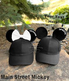 two mickey mouse ears with a white bow on top of each other, and the words your text here