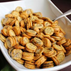 a white bowl filled with crackers on top of a table